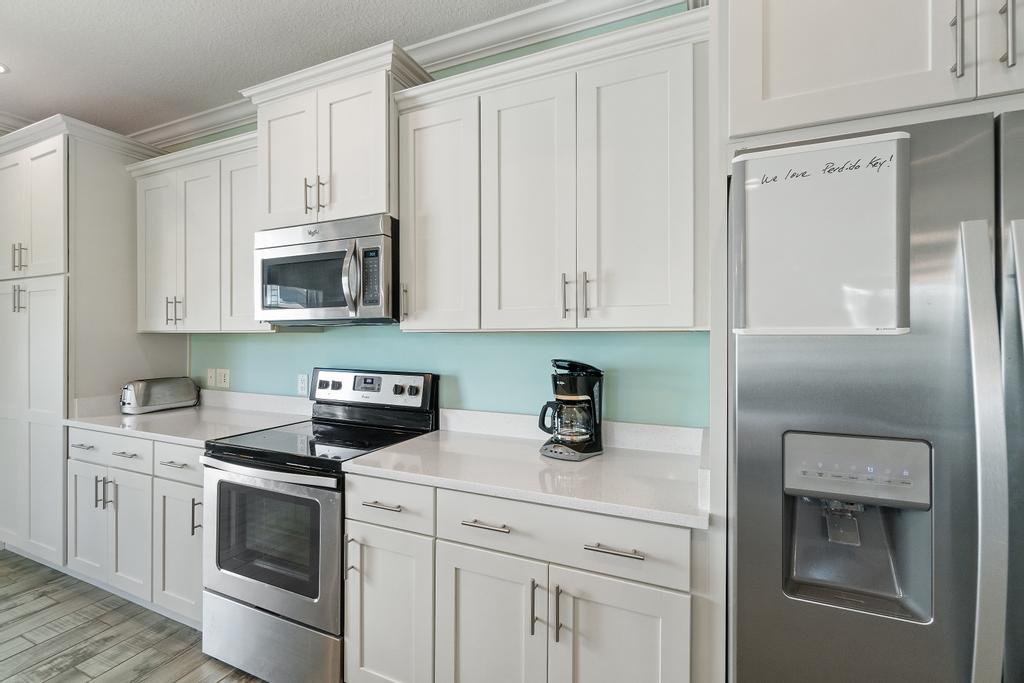 Open concept chef's kitchen with quartz countertops