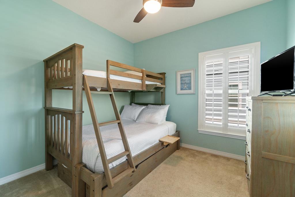 Bunk room with full size bed, twin on top, and trundle