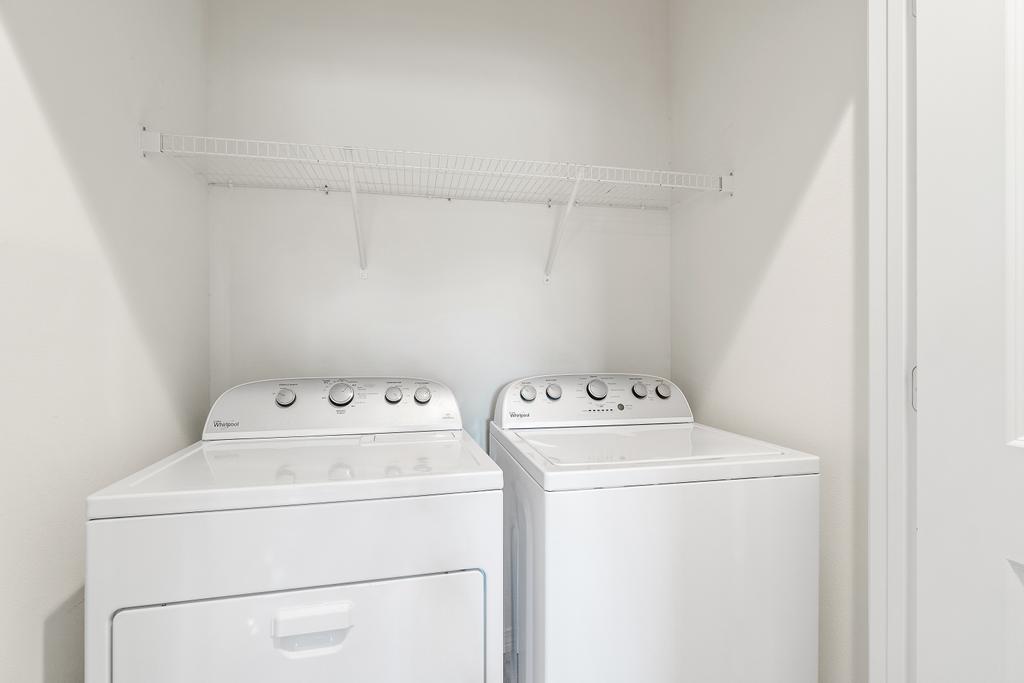 Full size washer and dryer in laundry room